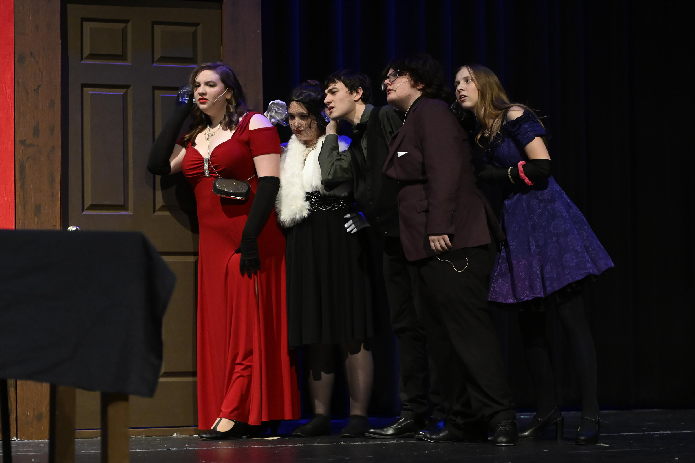 Miss Scarlet, Mrs. White, Mr. Green, Professor Plum, and Mrs. Peacock, played by Emily Rothbard, from left, Willa Weinreich, Reed Diffenderfer, Travis Gordon, and Maggie Beahm, listen through the door during a rehearsal of "Clue" at Winters Mill High School. (Thomas Walker/Freelance)