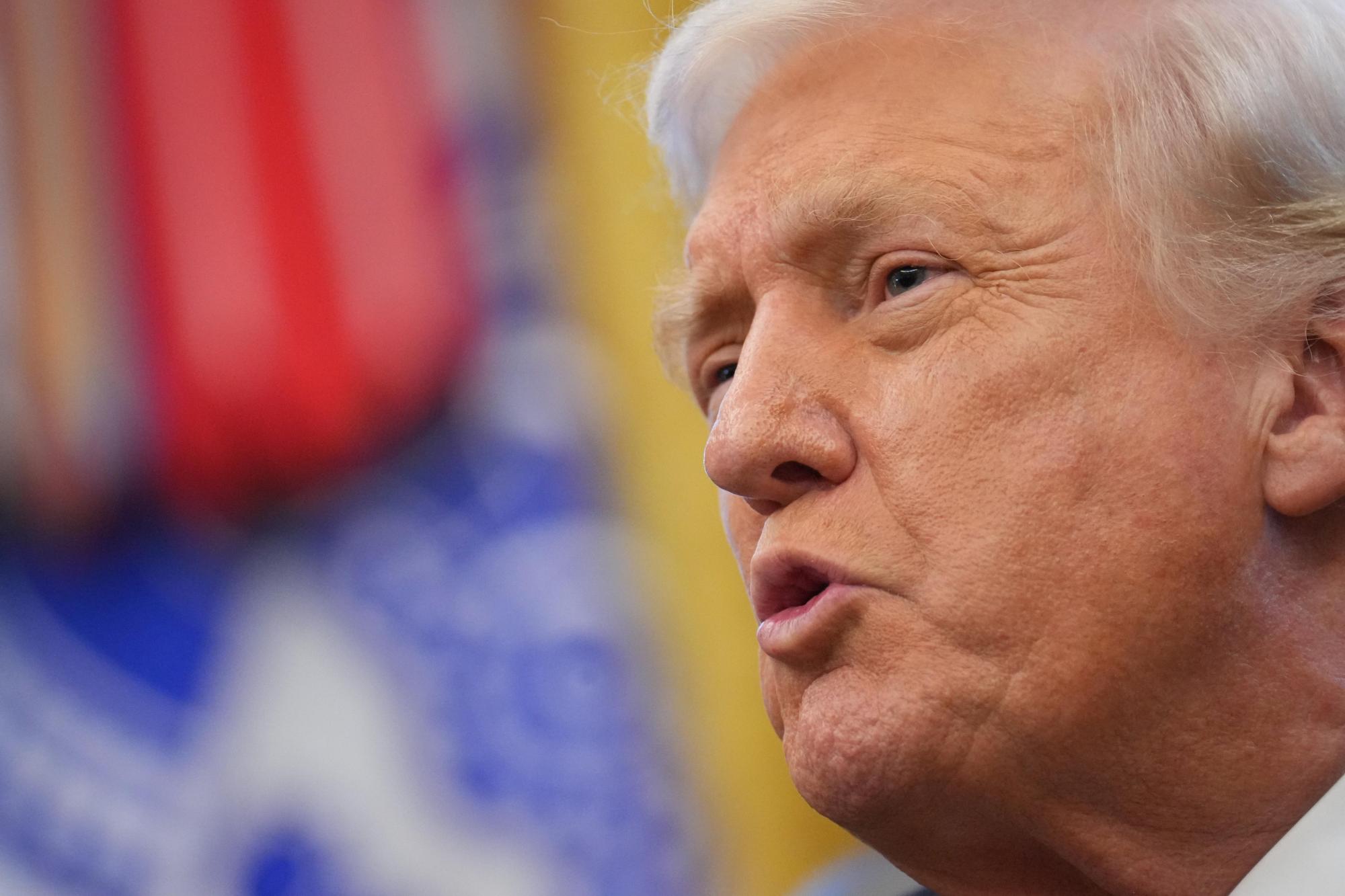 President Donald Trump speaks to reporters after Vice President JD Vance swore in U.S. Ambassador to India Sergio Gor in the Oval Office of the White House, Monday, Nov. 10, 2025, in Washington. (AP Photo/Jacquelyn Martin)
